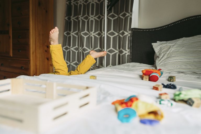 child playing on bed